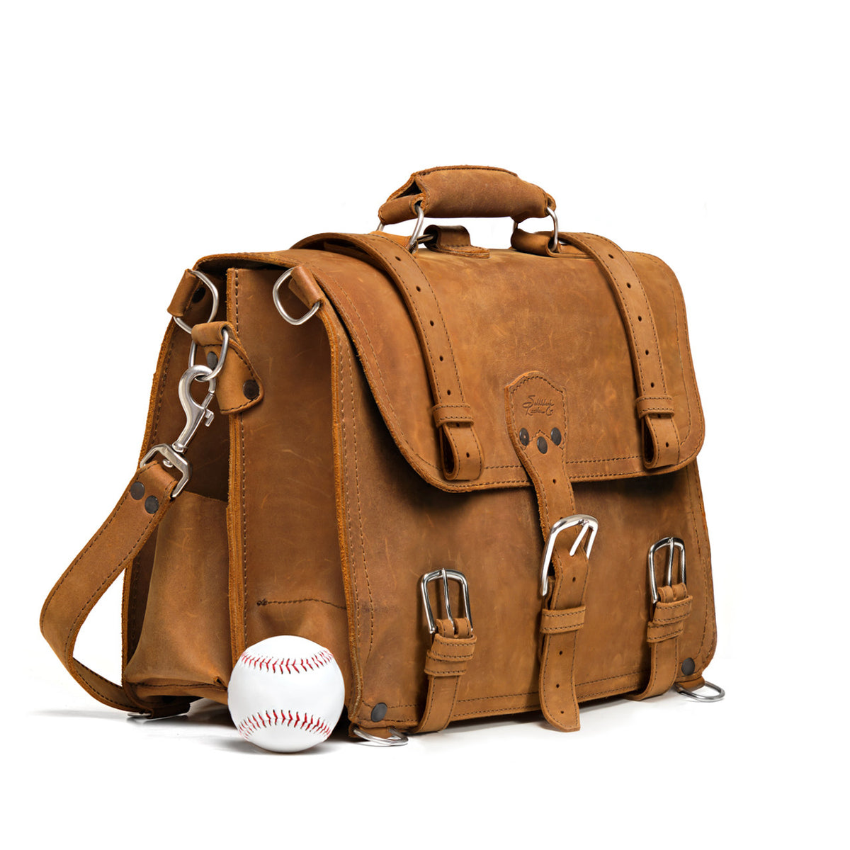 Large Classic Leather Briefcase in Tobacco, angled front view beside a baseball for size comparison