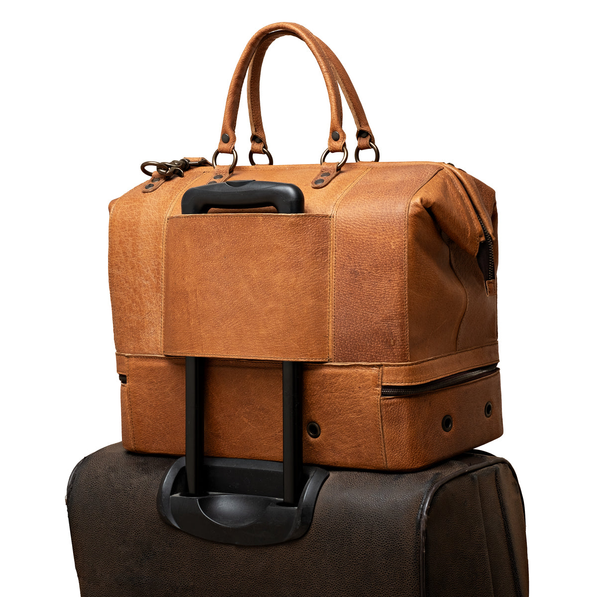 Two Compartment Duffle in Tobacco, back trolley sleeve slid over a rolling suitcase handle