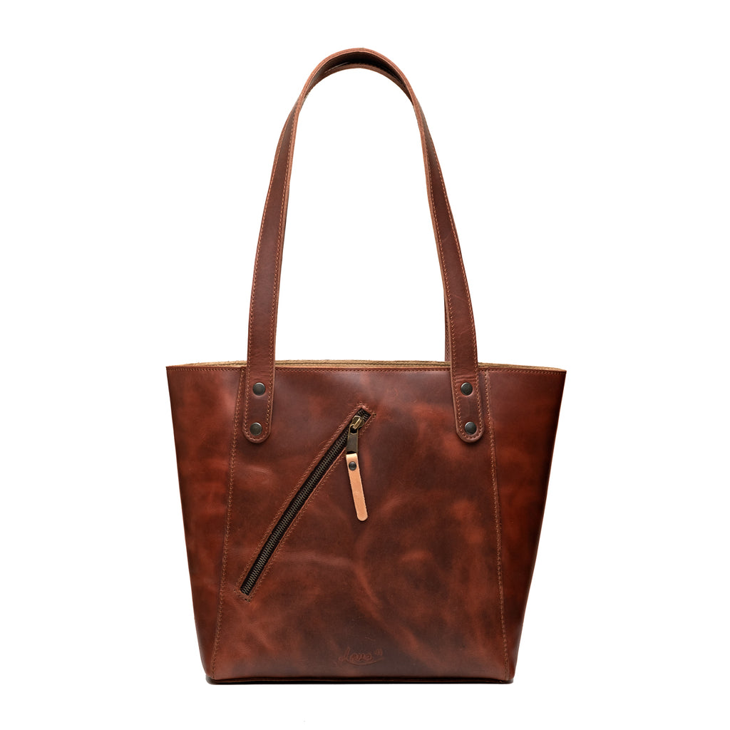Concealed Carry Leather Tote in Chestnut, front view with diagonal zippered pocket and shoulder straps
