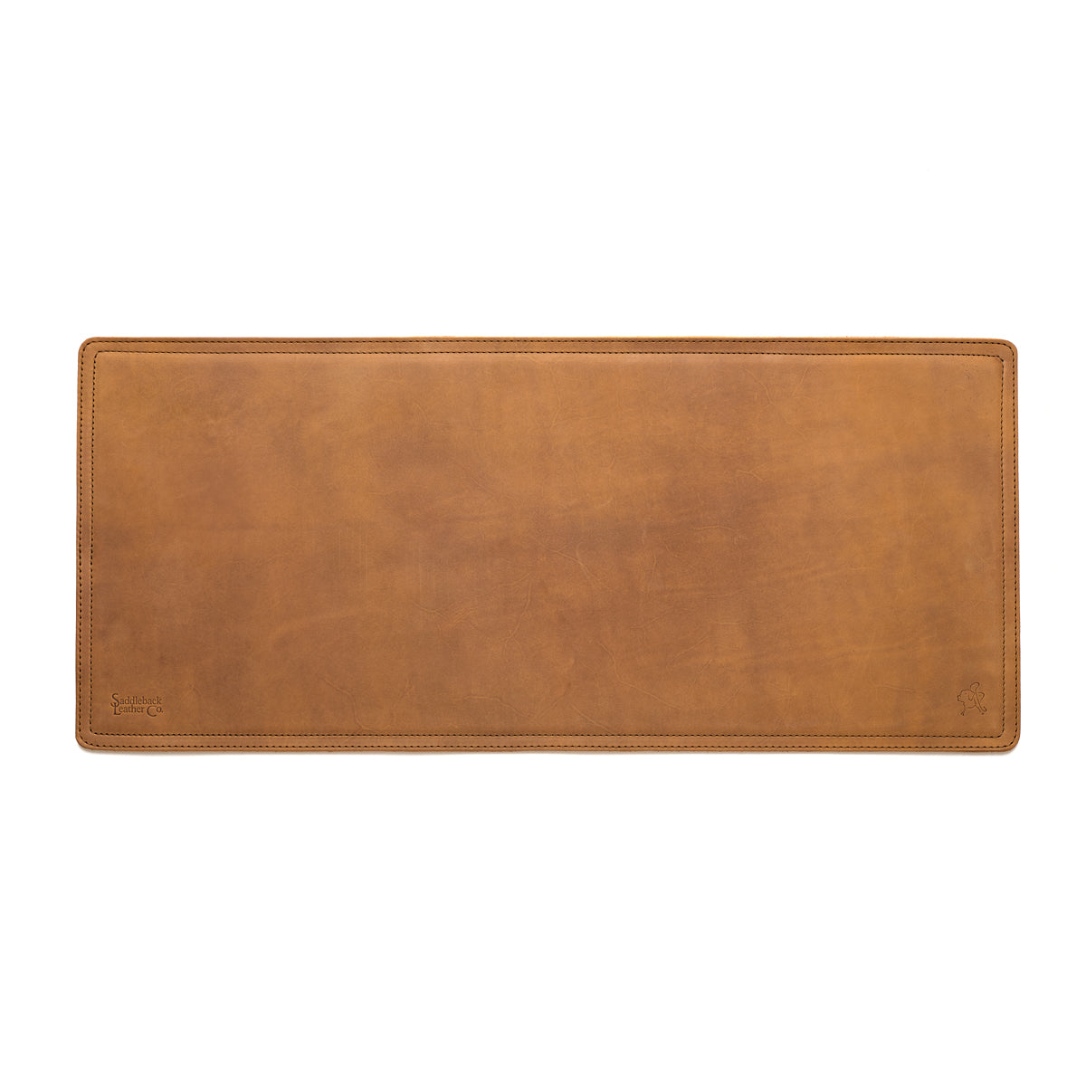 Long Desk Pad in Tobacco leather, empty top-down view showing stitched border and rounded corners