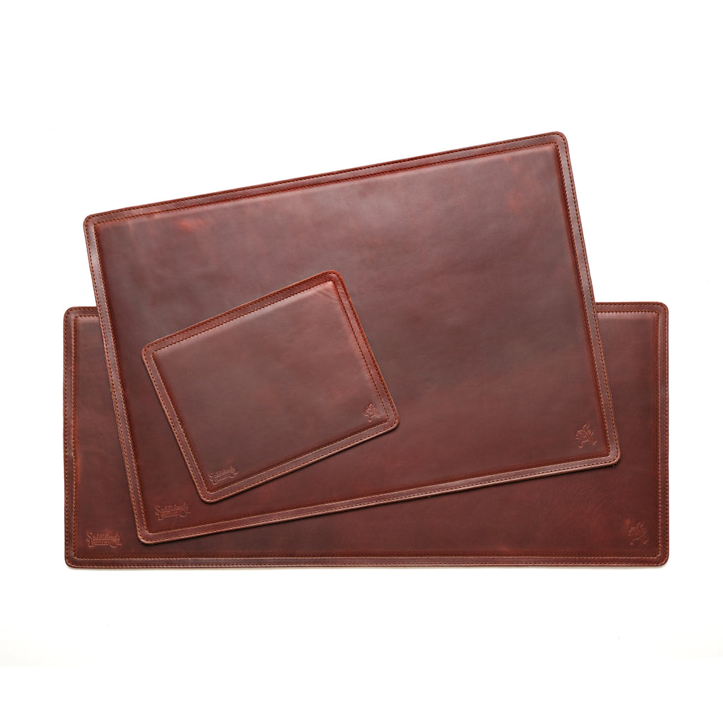 Long Desk Pad in Chestnut layered with the matching medium desk pad and mouse pad to compare sizes