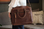 Women's Business Satchel in Chestnut, close-up carried at the hip on its shoulder strap