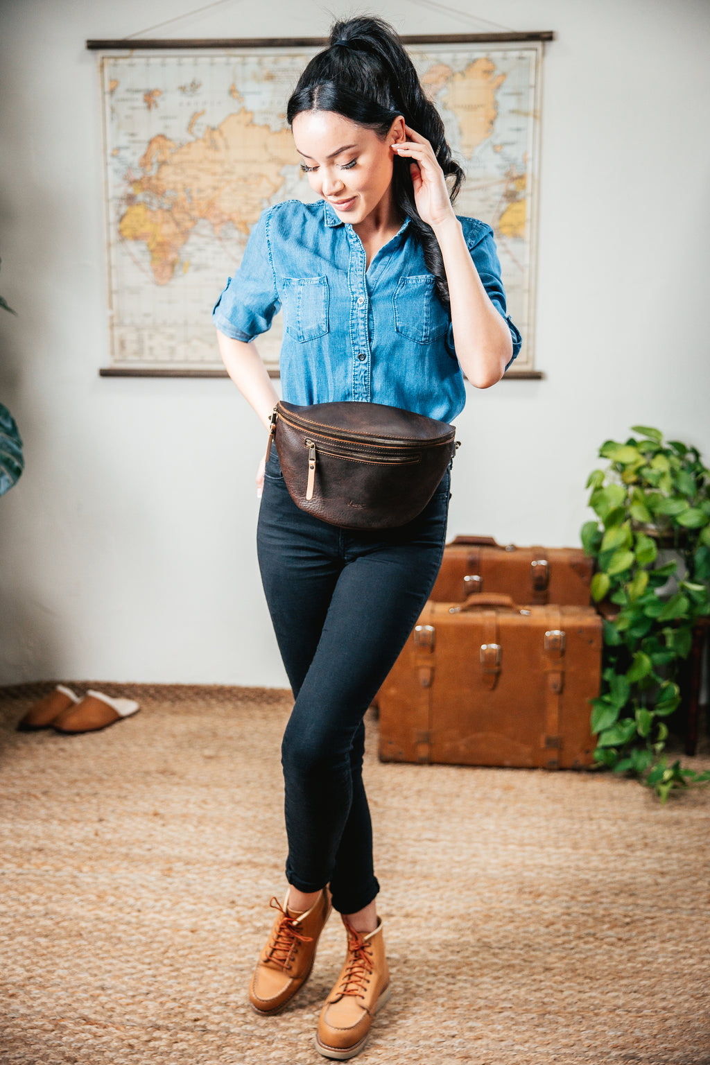 Leather Tumbled Fanny Bag in Dark Coffee Brown, worn at the waist by a woman in a denim shirt