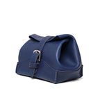 Saddleback Club Membership George Washington Leather Roll-Up Toiletry Bag in Blue, angled side view with buckle strap