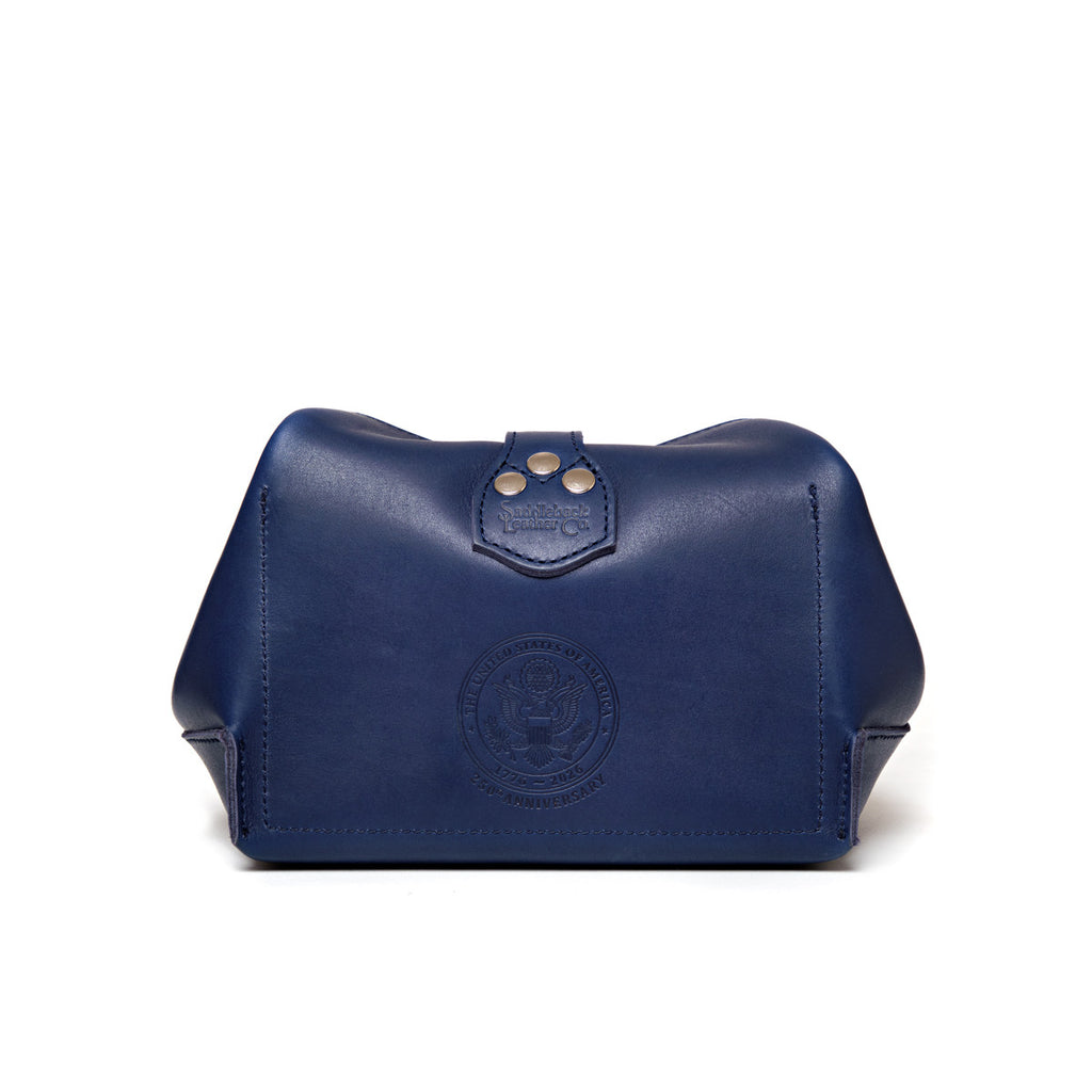 Saddleback Club Membership George Washington Leather Roll-Up Toiletry Bag in Blue, back view with embossed seal and riveted tab