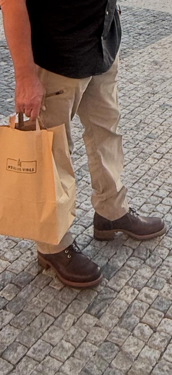 High quality side view of the Huntsman boot in dark brown on a person