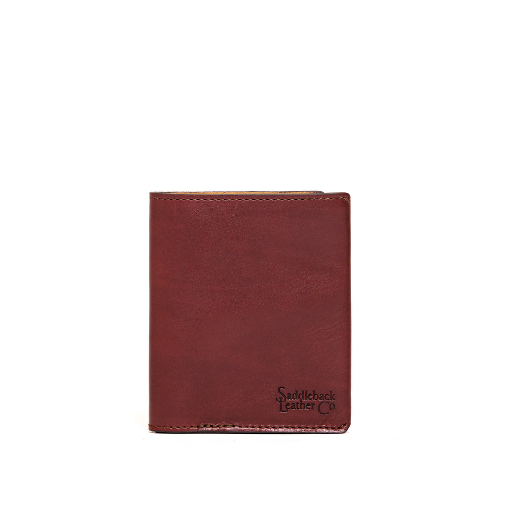 Large Bifold Wallet in Oxblood, closed front view with debossed Saddleback Leather Co. logo