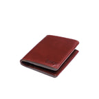 Large Bifold Wallet in Oxblood, closed angled view with embossed logo on the front
