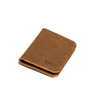 Large Bifold Wallet in Tobacco, closed and angled showing the stitched spine and embossed logo