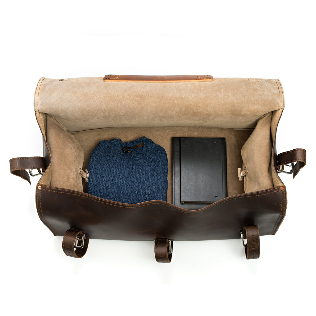27" Adolescent Beast Duffle Bag in Dark Coffee Brown, top view open with a folded sweater and black case inside