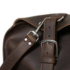 27" Adolescent Beast Duffle Bag in Dark Coffee Brown, close-up of the end buckle strap and shoulder strap swivel hook
