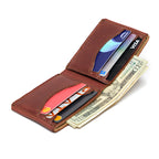 Medium Bifold Wallet in Chestnut opened at an angle, filled with cards in both pockets and folded cash