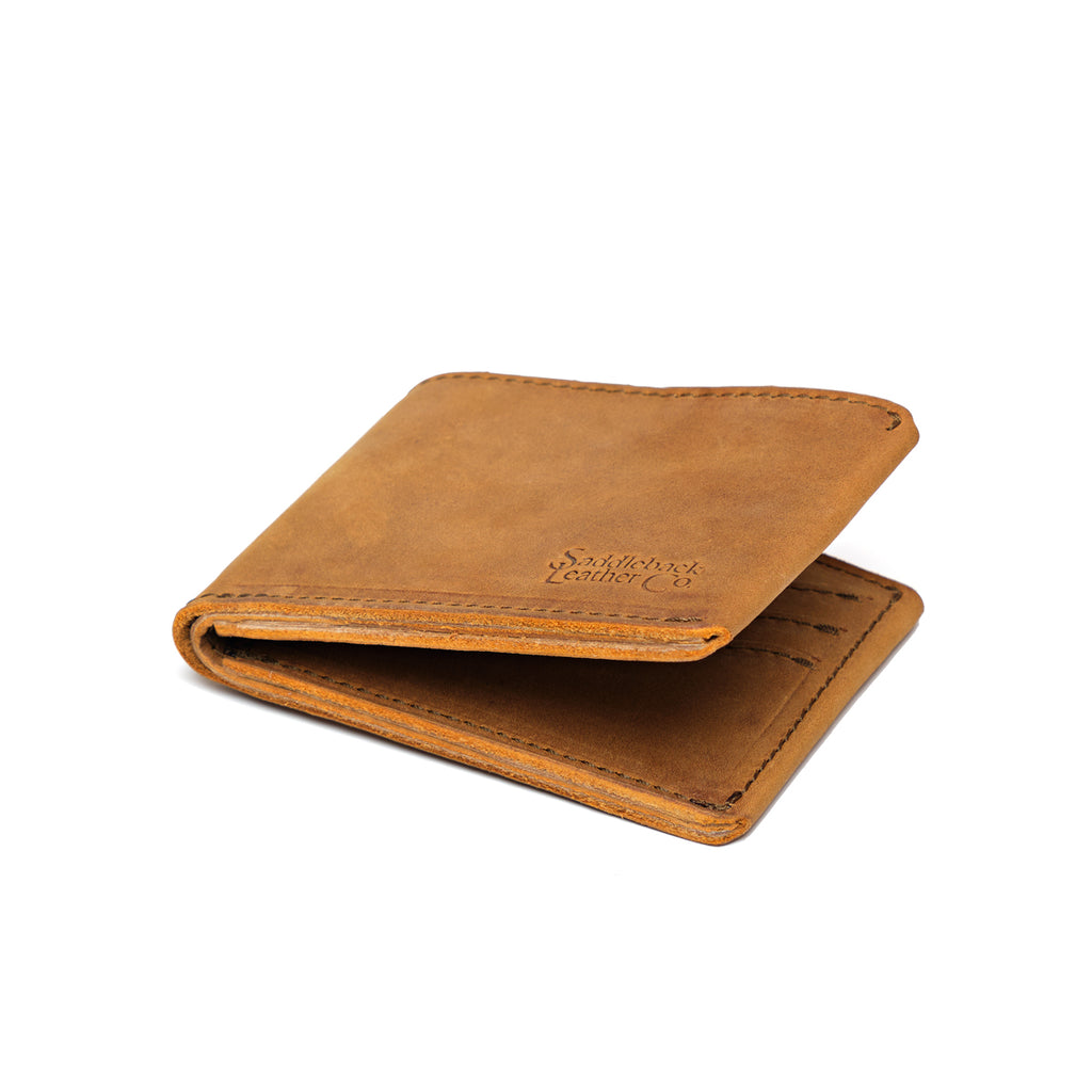 Medium Bifold Wallet in Tobacco, angled view slightly open with embossed logo and stitched edges