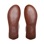 Sheepskin Moccasins in Dark Coffee Brown, bottom view of the stamped leather soles