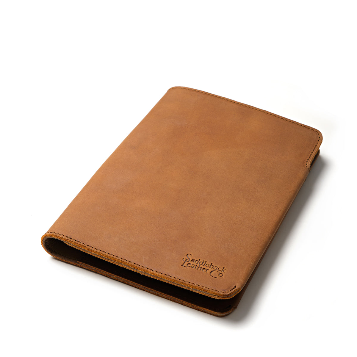 Medium Moleskin Cover in Tobacco, closed and angled showing stitched edges and debossed logo