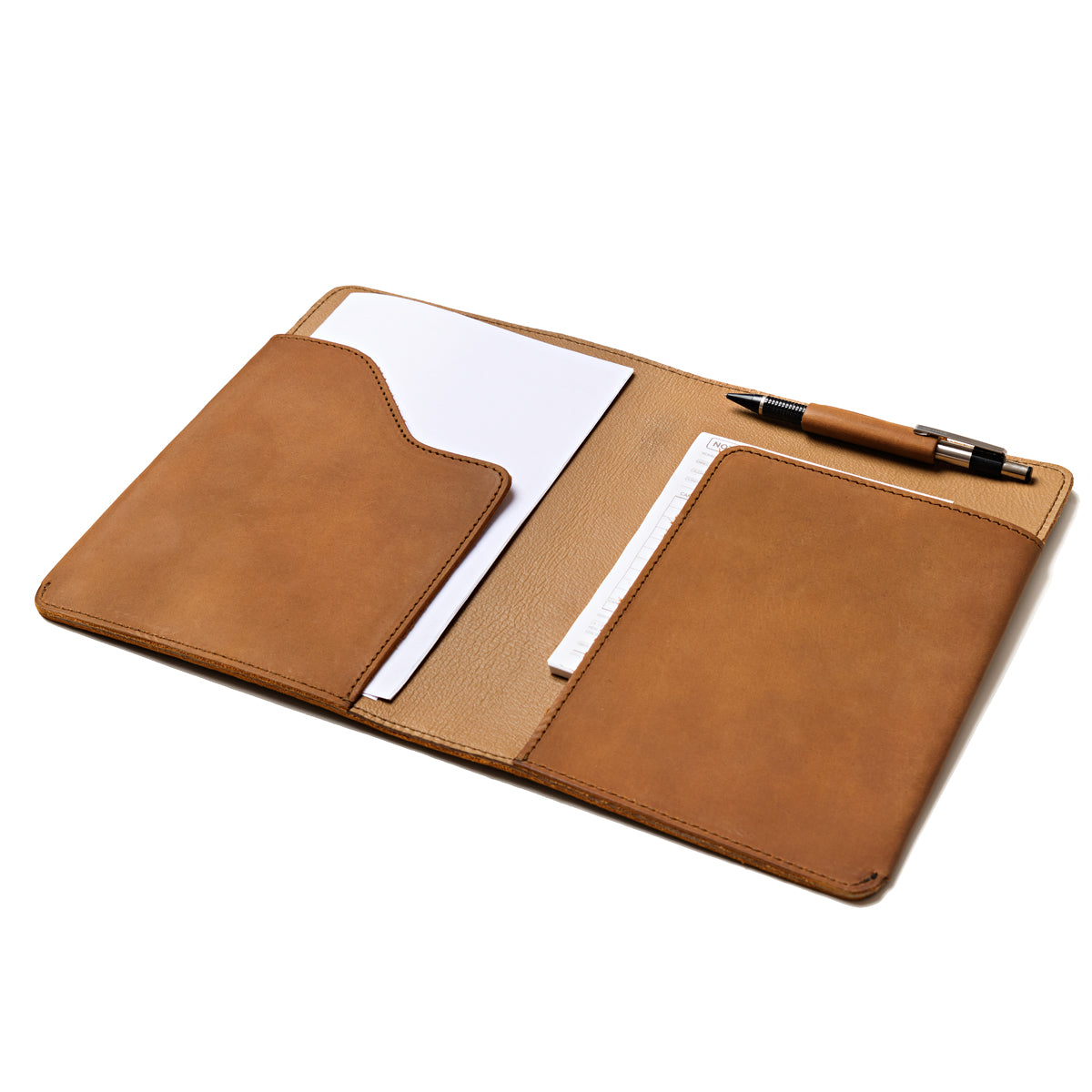 Medium Moleskin Cover in Tobacco, open showing interior pockets with paper and a pen