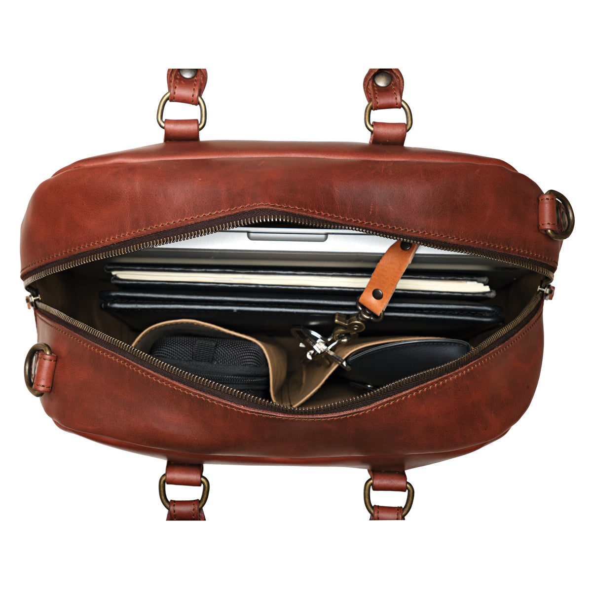 Professional Leather Satchel in Chestnut, top view unzipped with a laptop, notebook and sunglasses inside
