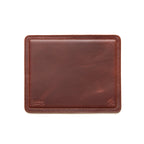 Mouse Pad in Chestnut leather, empty top-down view with stitched border and embossed logo