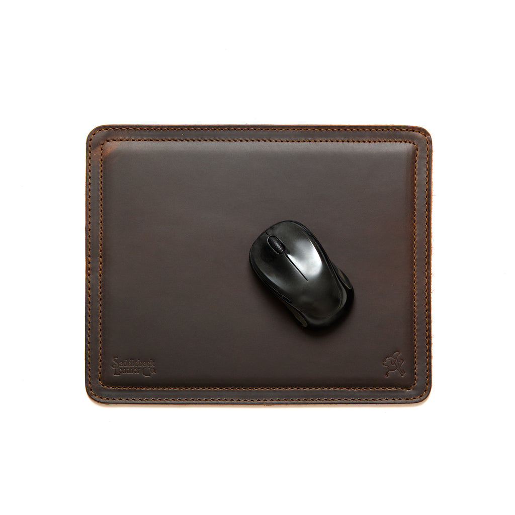 Mouse Pad in Dark Coffee Brown leather with a black wireless mouse, overhead view showing stitched edges