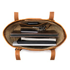 Original Tote in Tobacco, top-down view packed with a laptop, notebooks, folders and keys