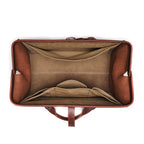 Leather Range and Tool Bag in Chestnut, top view open and empty showing the lined interior and slip pockets