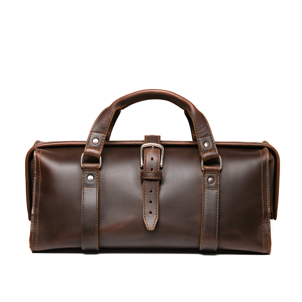 Leather Range and Tool Bag in Dark Coffee Brown, front view with top handles, center buckle strap and frame opening