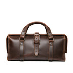 Leather Range and Tool Bag in Dark Coffee Brown, front view with top handles, center buckle strap and frame opening