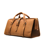 Leather Range and Tool Bag in Tobacco, angled front view with top handles, buckle strap and side frame opening
