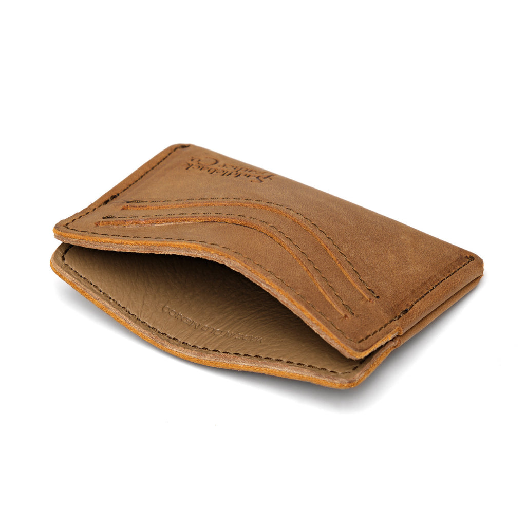 Newton Wallet in Tobacco, empty and opened slightly to show the center pocket