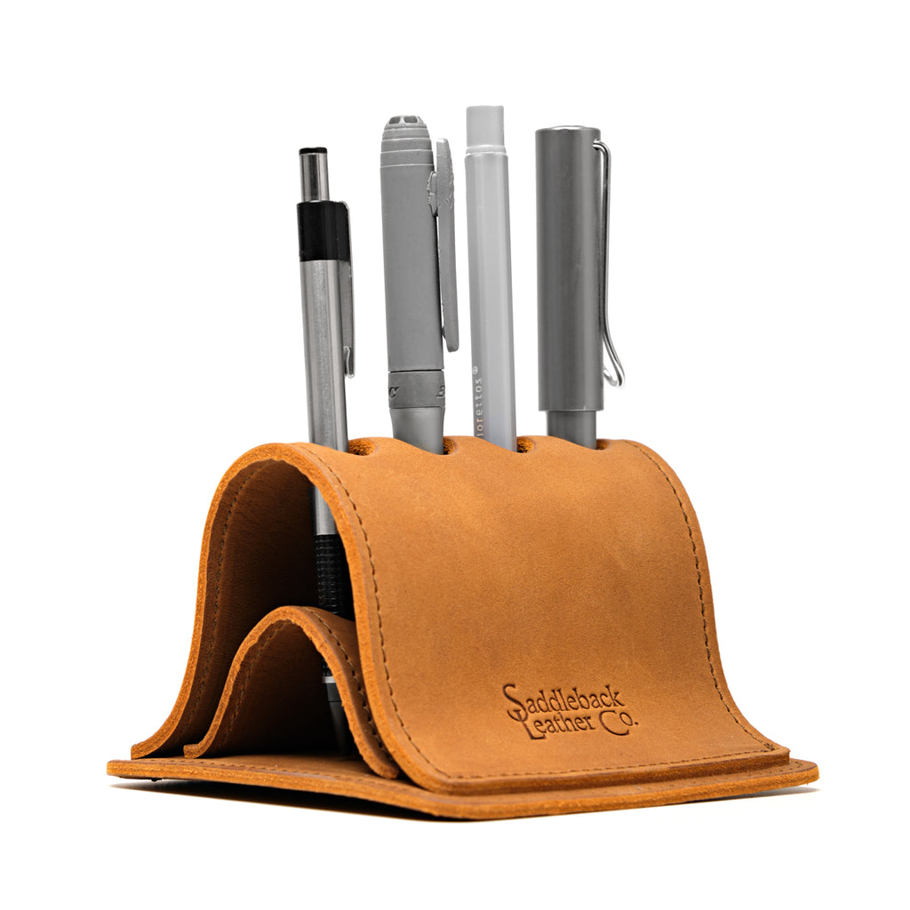 Pen Holder Bell Curve in Tobacco leather, angled front view holding four pens