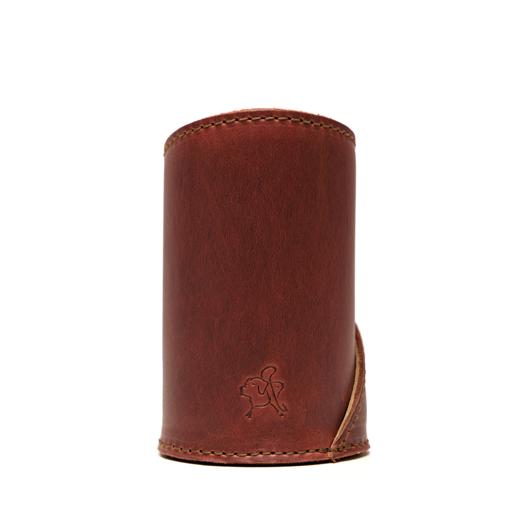 Pen Cup in Chestnut leather, back view of the empty cup with embossed pig logo and stitched edges