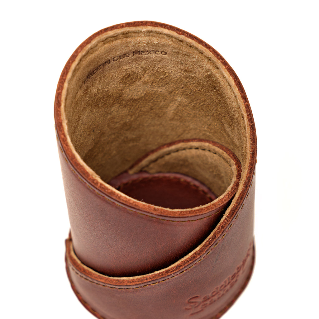 Pen Cup in Chestnut leather, close-up top view of the spiral wrap, stitched edges and suede interior