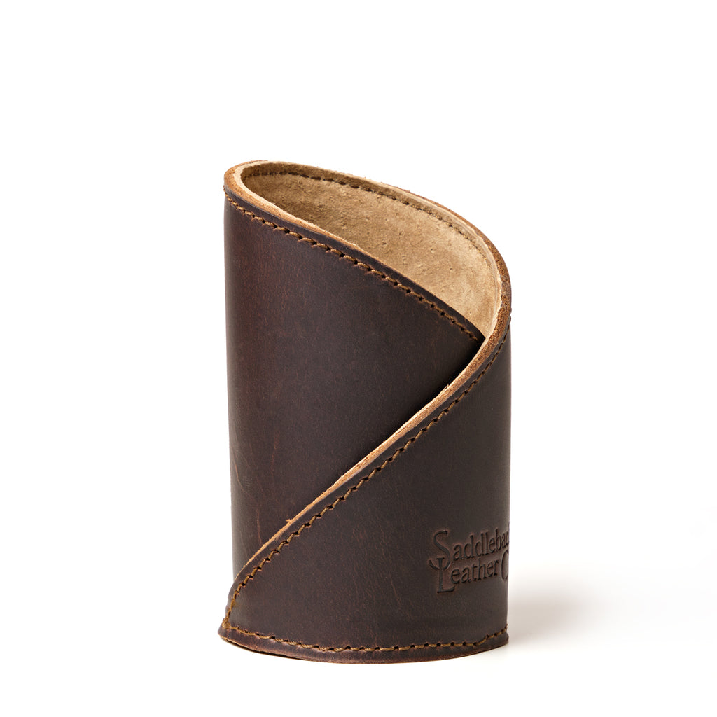 Pen Cup in Dark Coffee Brown leather, front view of the empty cup with diagonal stitched wrap and embossed logo