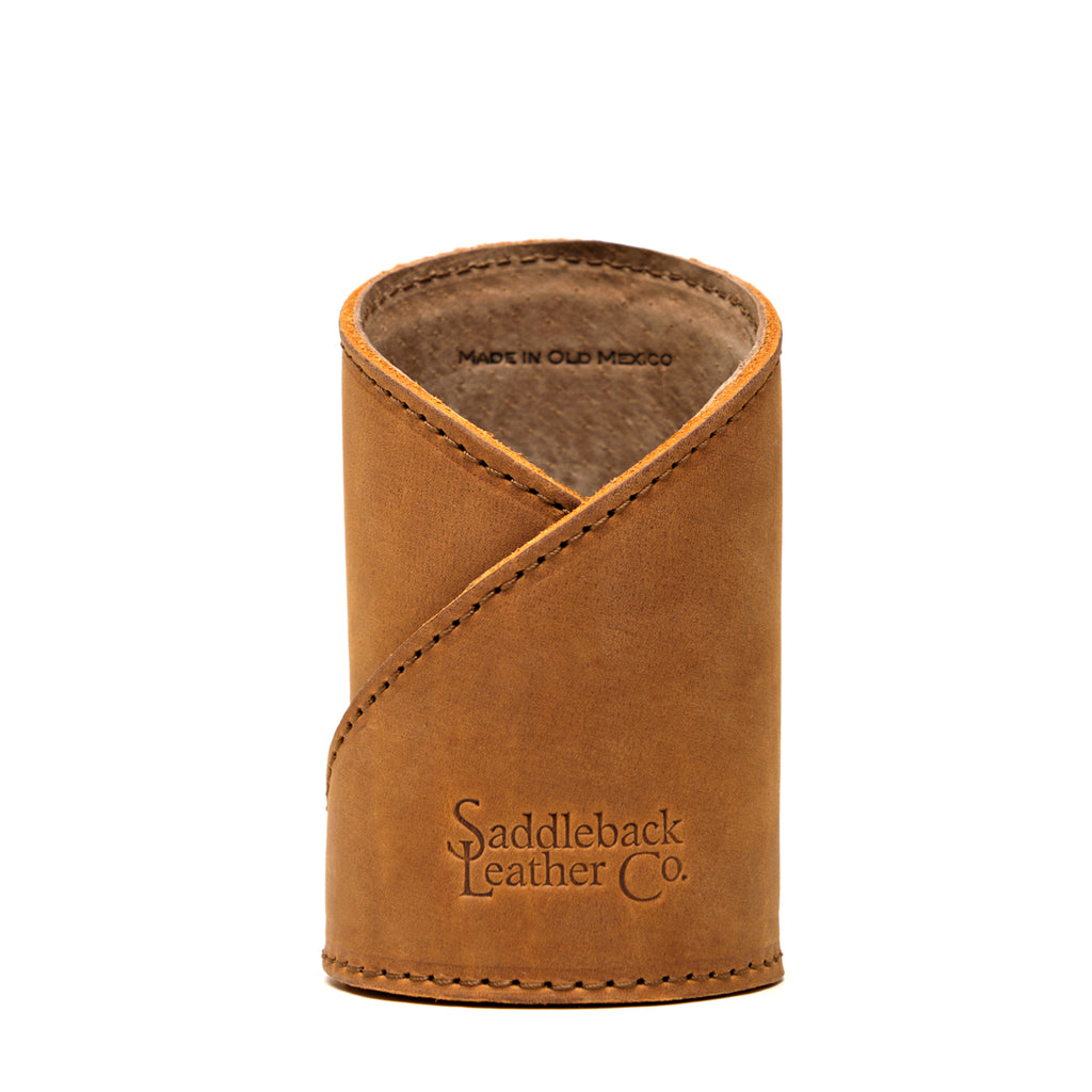 Pen Cup in Tobacco leather, front view with large embossed Saddleback Leather Co. logo and crossed stitched wrap