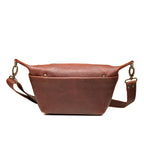 London Sling Small in Chestnut, front view with snap pocket and adjustable strap