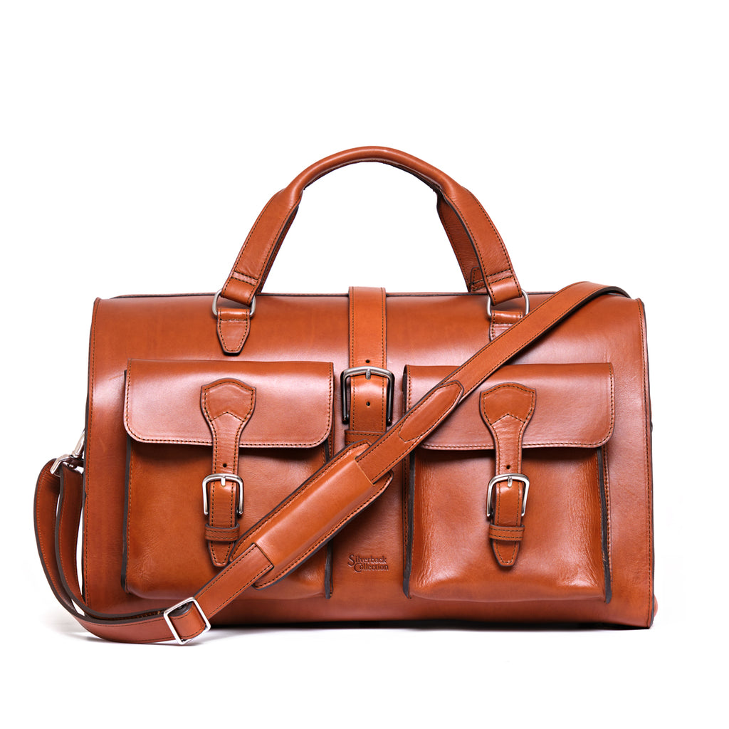Wesley Deep Pocket Duffle in English Tan, front view with two buckled pockets and shoulder strap