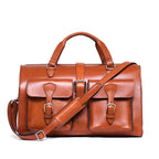 Wesley Deep Pocket Duffle in English Tan, front view with two buckled pockets and shoulder strap