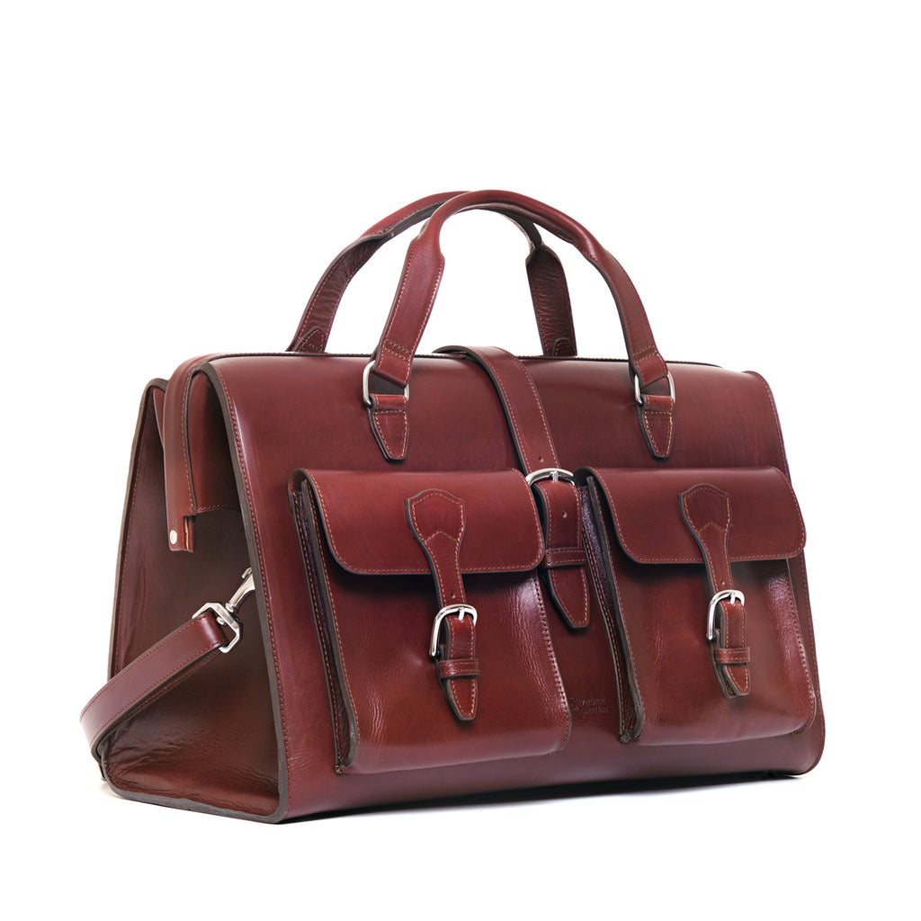 Wesley Deep Pocket Duffle in Oxblood, three-quarter view showing front pockets and side