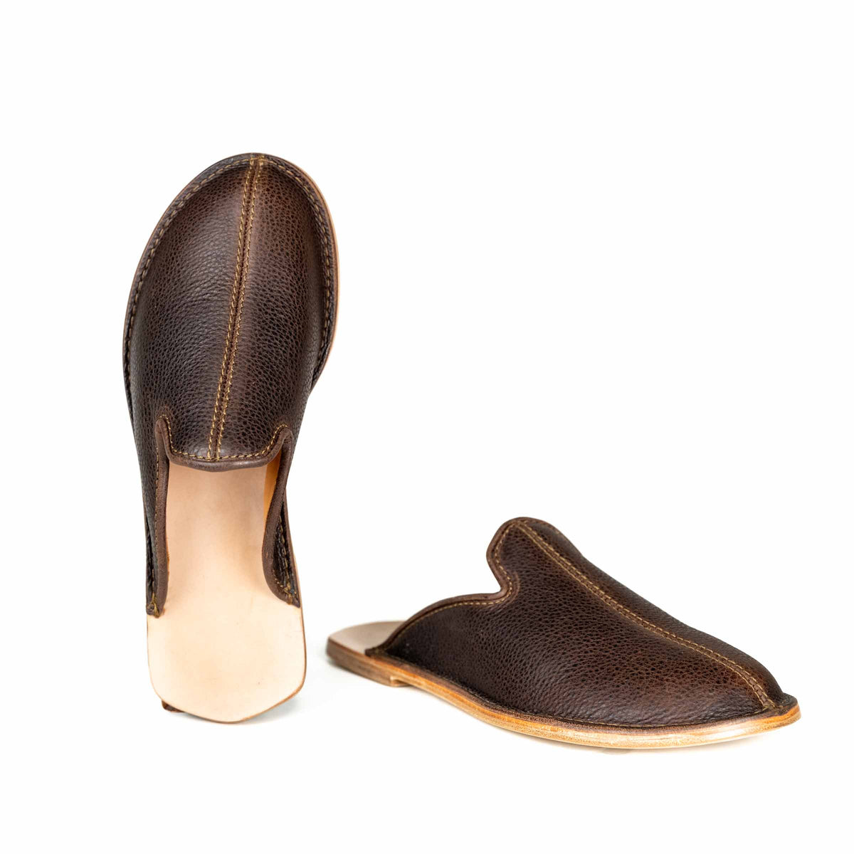 Barefoot Slip-on Mules in Dark Coffee Brown, one standing on its heel and one in side profile