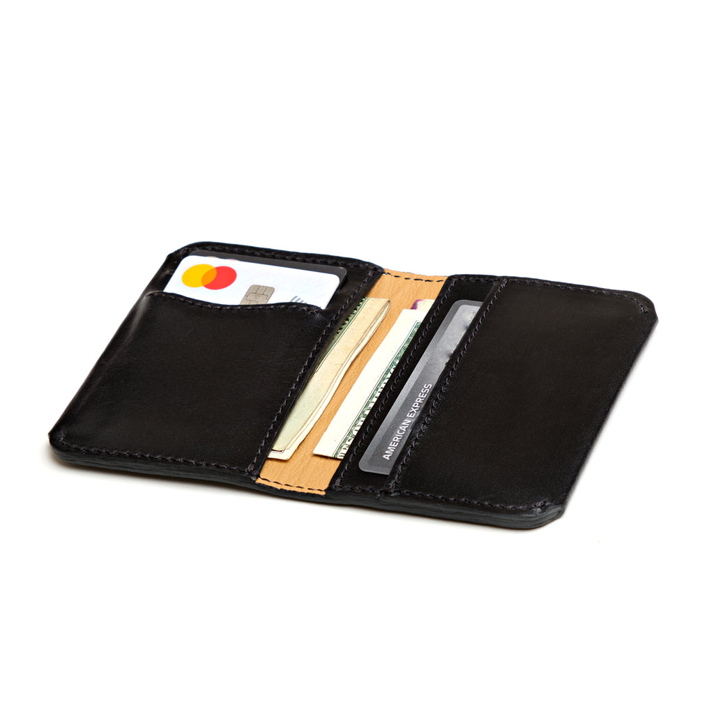 Slim Bifold Wallet in Black, open view with cards and cash in the slots