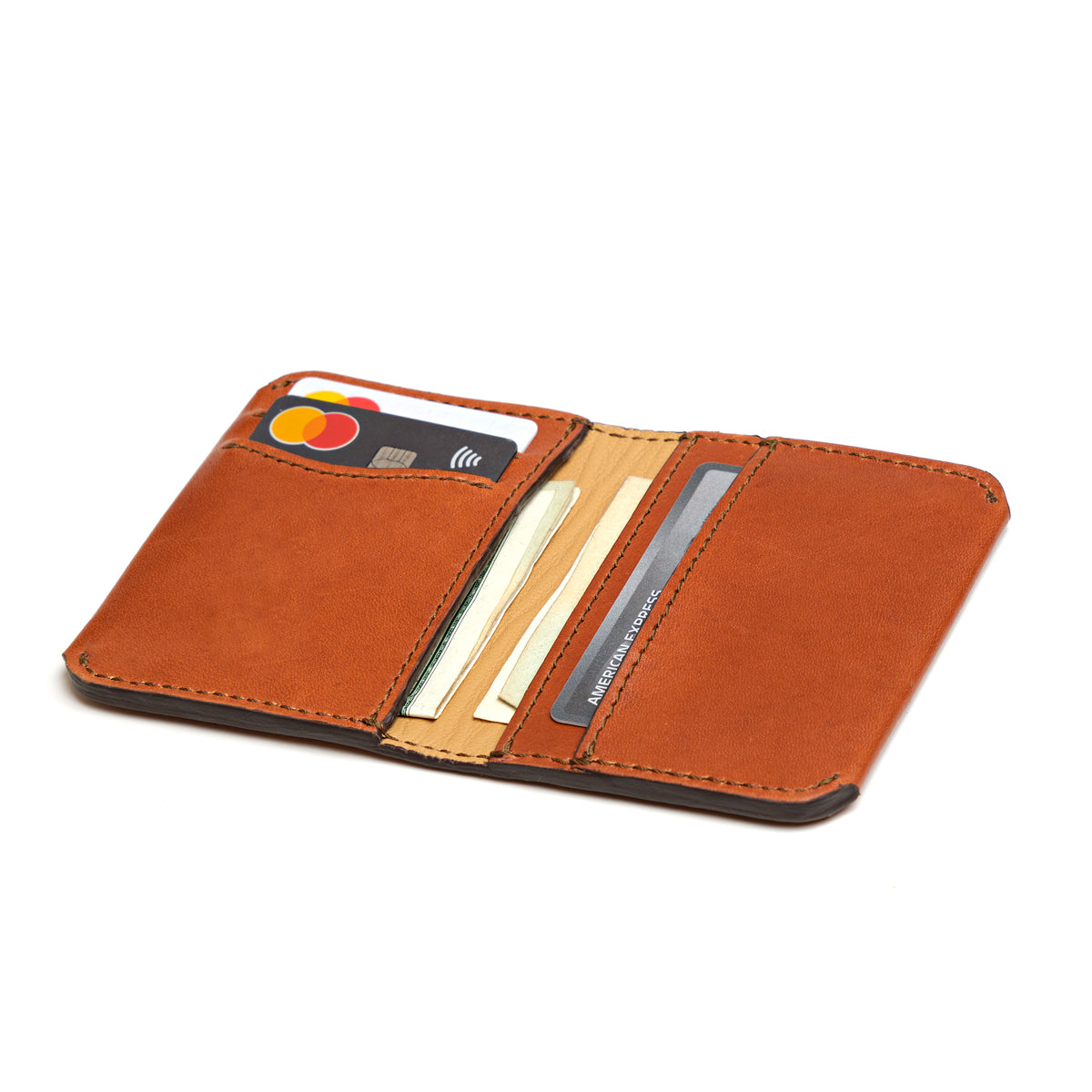 Slim Bifold Wallet in English Tan, open view with cards and cash in the slots