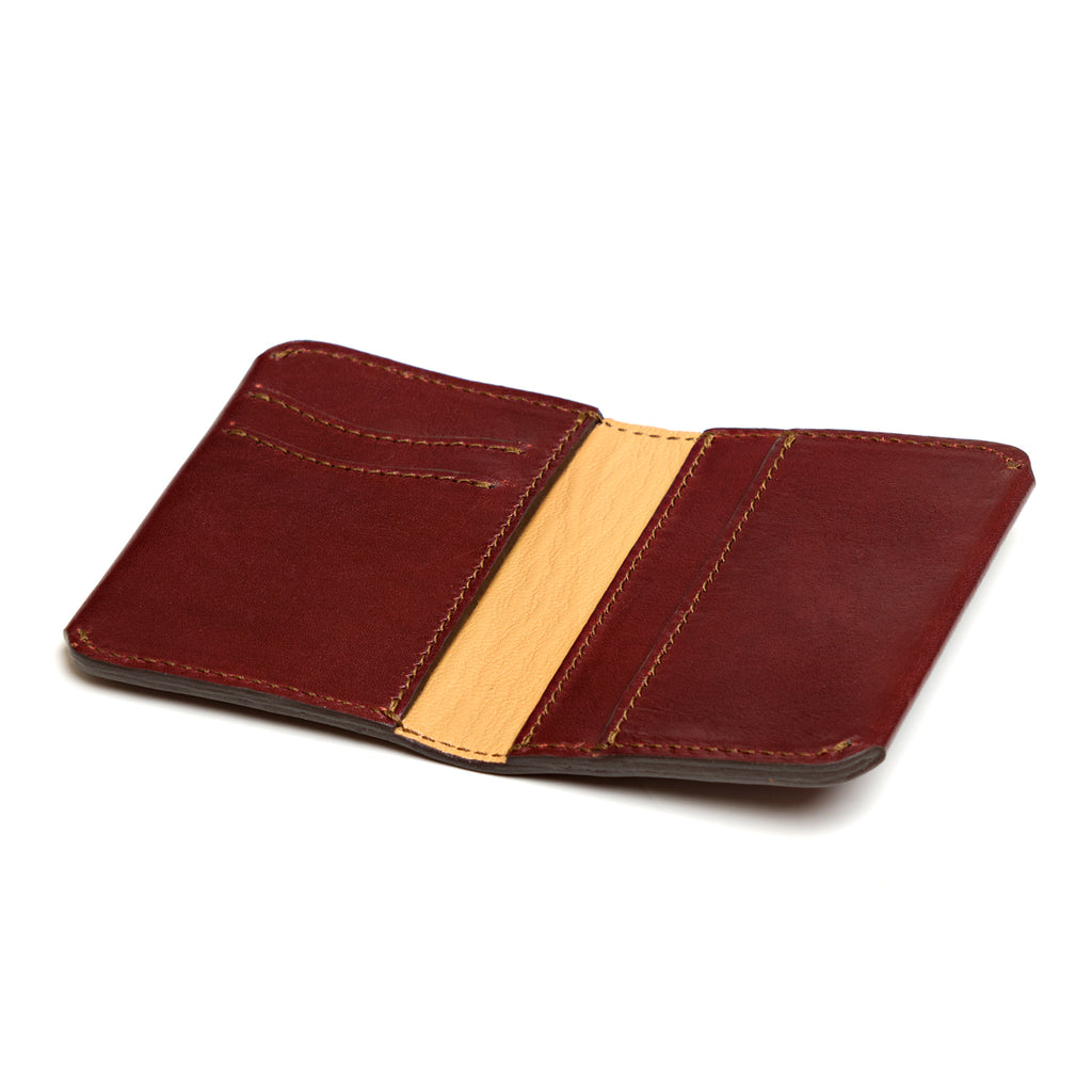 Slim Bifold Wallet in Chestnut, open empty view showing card slots and tan center panel