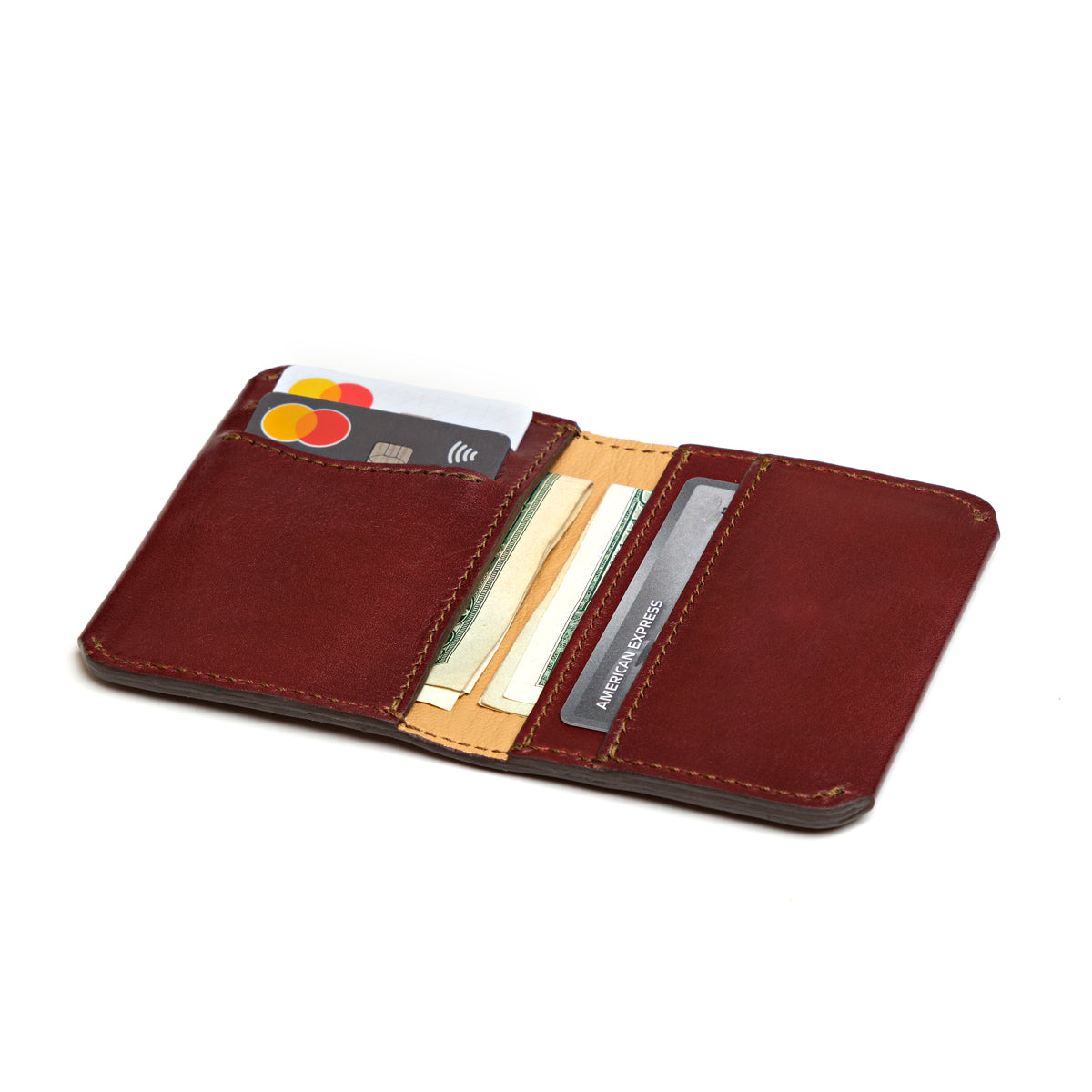 Slim Bifold Wallet in Chestnut, open view with cards and cash in the slots