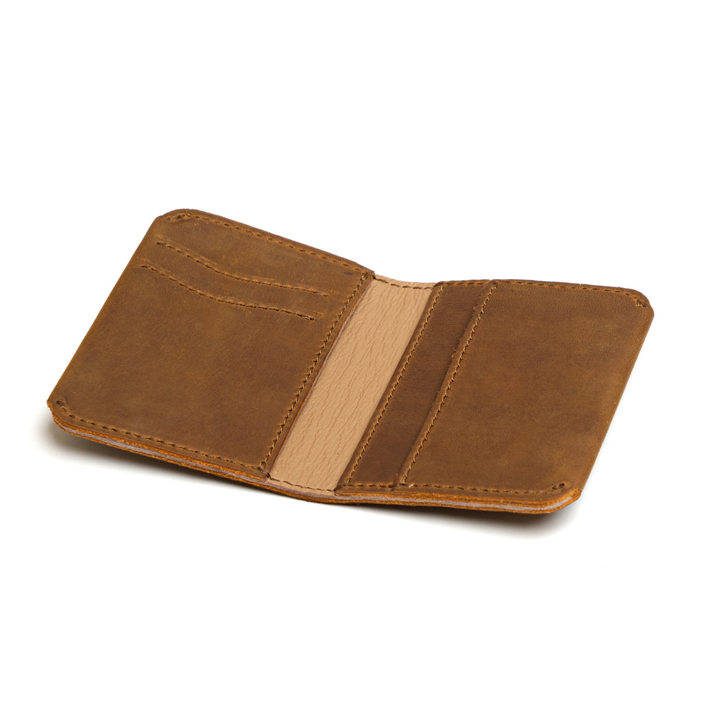 New Slim Leather Bifold Wallet in Tobacco opened empty to show the card pockets and center slip pocket