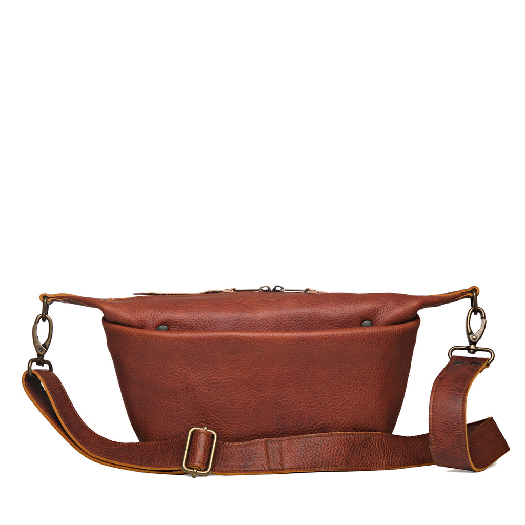London Sling Small in Chestnut, front view with snap pocket and full-length buckled strap