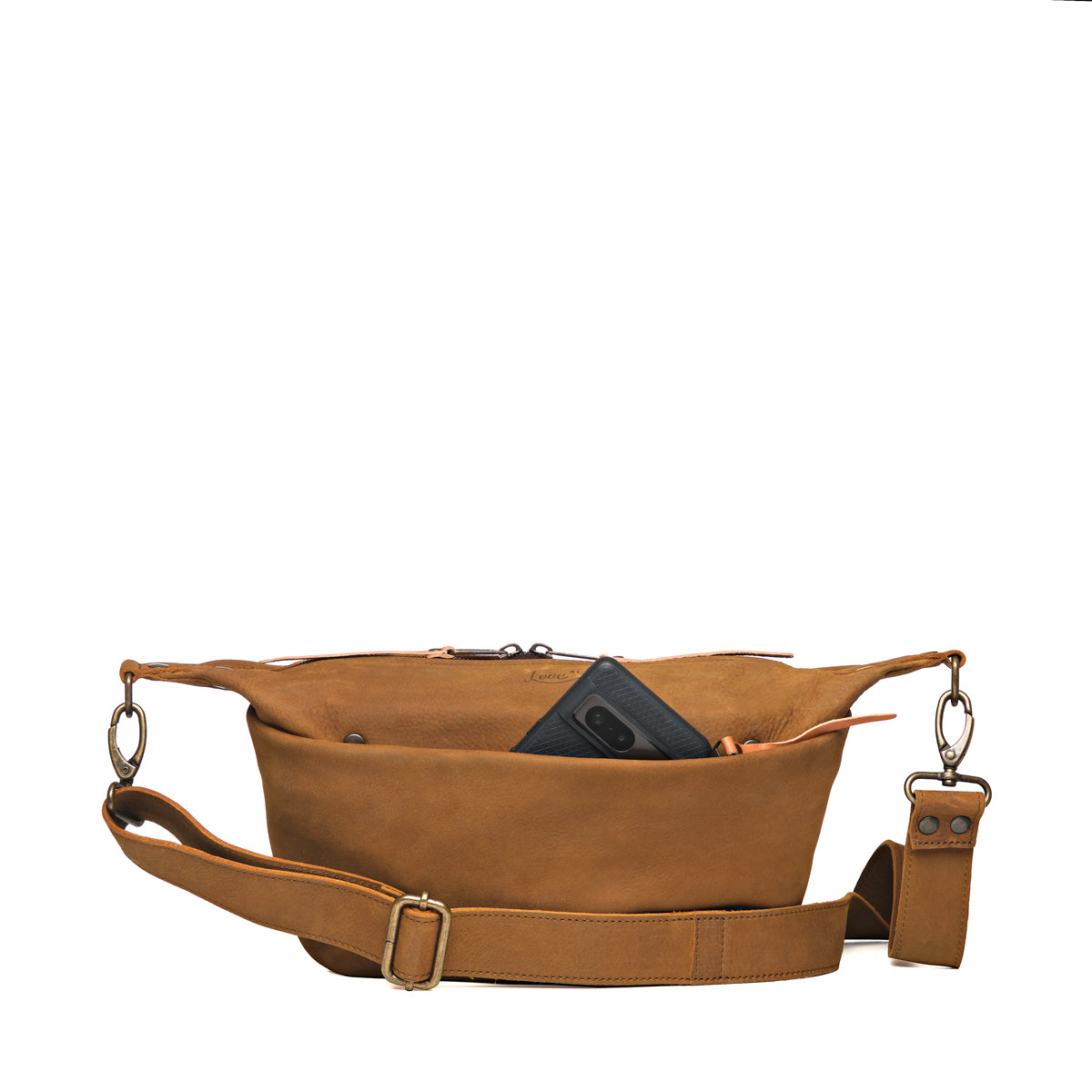 London Sling Small in Tobacco, front view with a phone tucked in the snap pocket