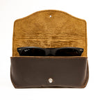 Leather Sunglass Case in Dark Coffee Brown, flap open to show suede lining with a pair of sunglasses inside