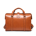 Spurgeon Briefcase in English Tan, back view with handle straps and riveted leather tab