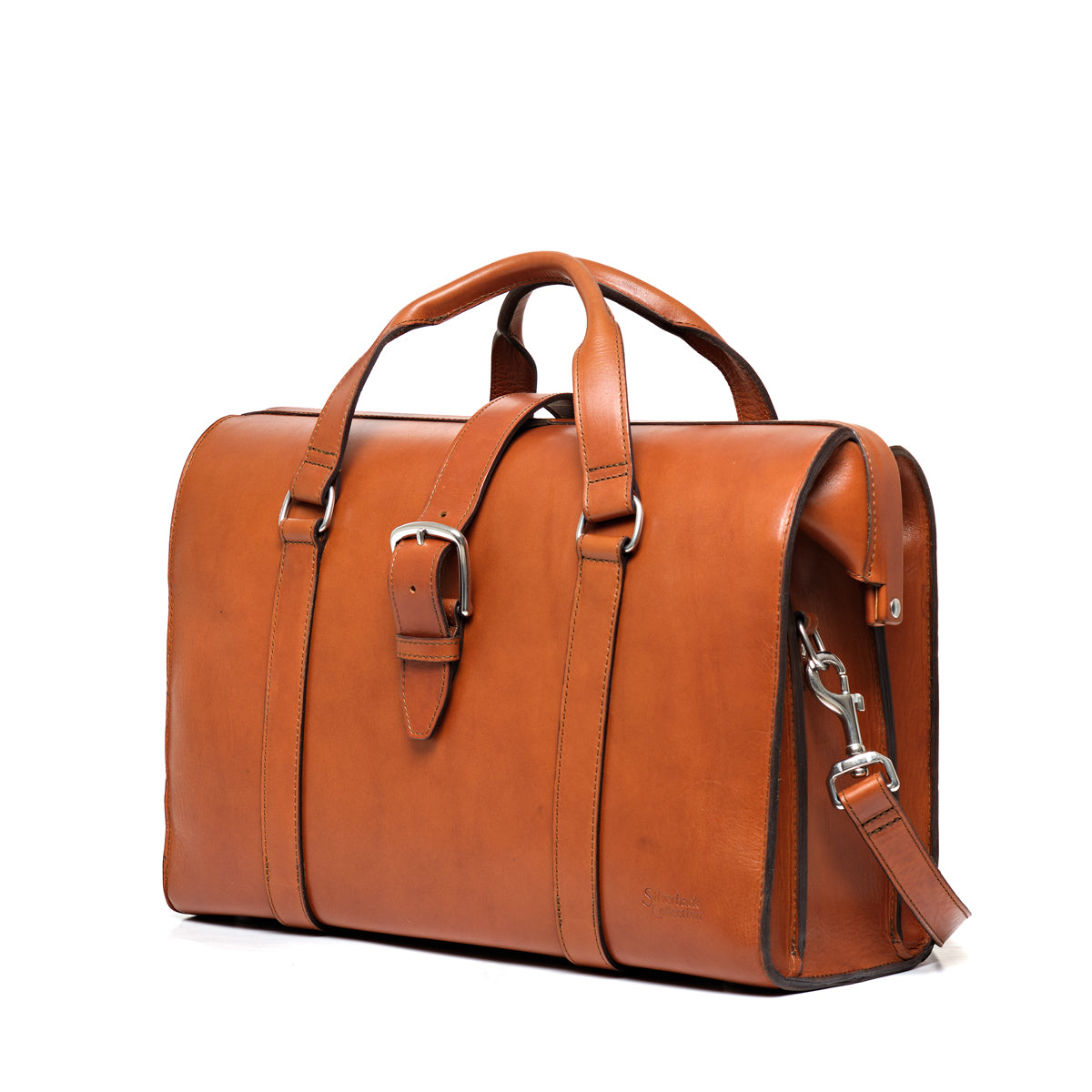 Spurgeon Briefcase in English Tan, angled side view showing the buckle strap and shoulder strap clip