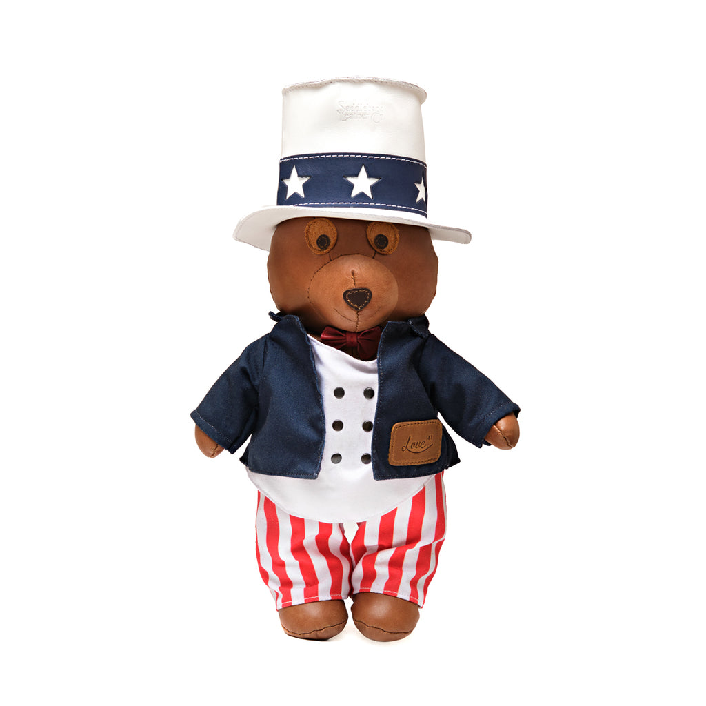 2026 Uncle Sam Teddy Bear, front view in star top hat, navy jacket with leather pocket patch and striped pants